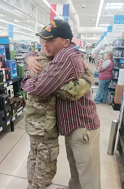 Welcome home soldier hugs with Veteran David Haave.